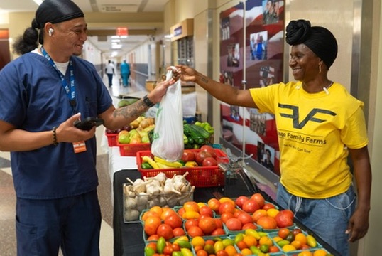 Sharing fresh Village Family Farms produce with the community